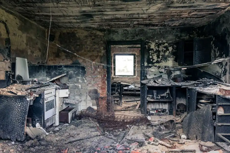 Explore an abandoned, fire-damaged kitchen illustrating decay and destruction.